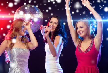 Three smiling women dancing in the club clipart