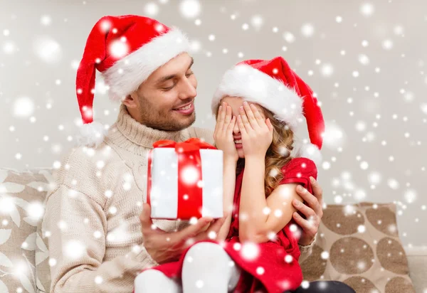 Smiling daughter waiting for a present from father — Stock Photo, Image