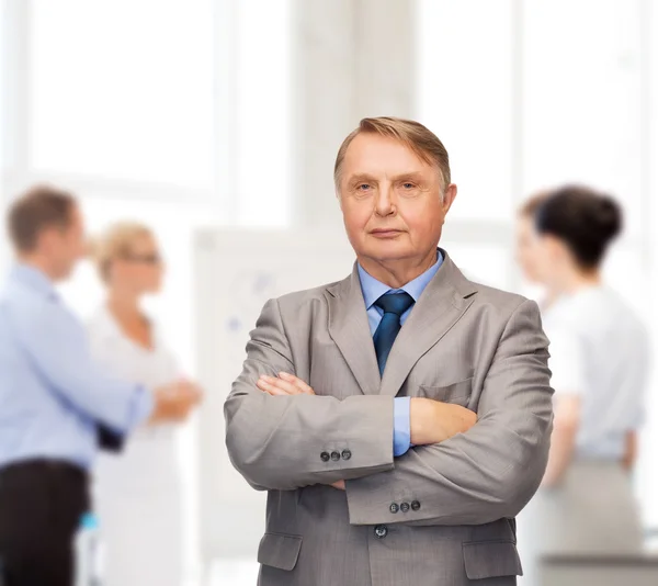 Serious businessman or teacher in suit — Stock Photo, Image