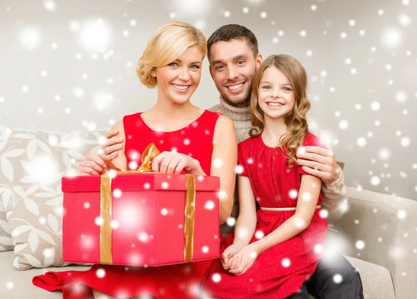 Happy family opening gift box — Stock Photo, Image