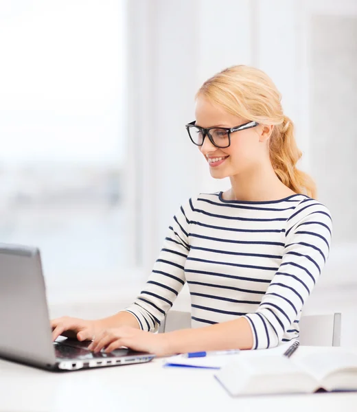 Student with laptop computer and eyeglasses — Stock Photo, Image