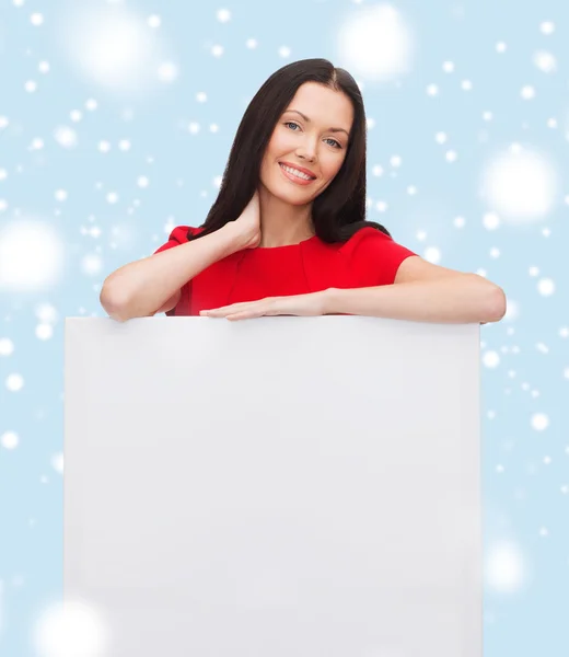 Smiling young woman with blank white board — Stock Photo, Image