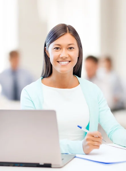 Asian businesswoman with laptop and documents — Stock Photo, Image