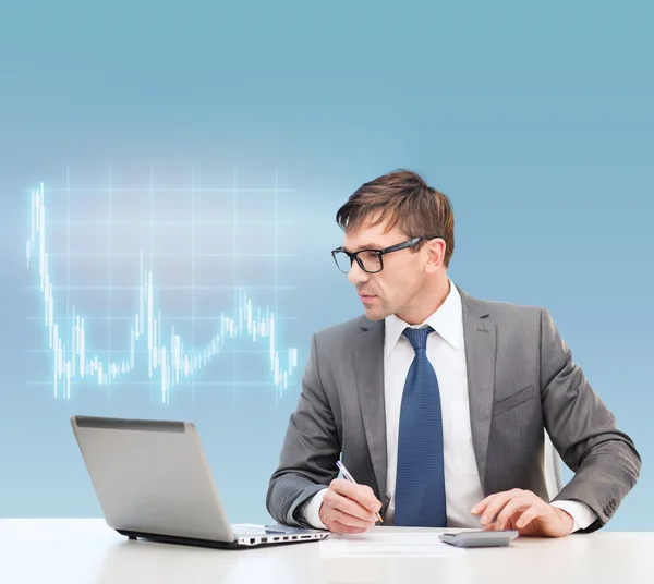 Businessman with computer, papers and calculator — Stock Photo, Image