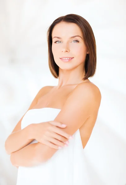 Beautiful woman standing in towel — Stock Photo, Image