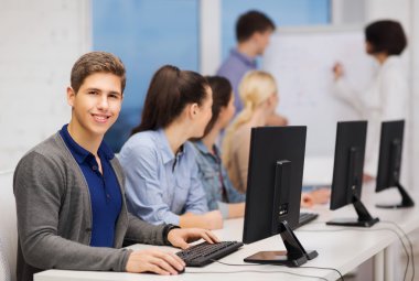 Students with computer monitor at school clipart