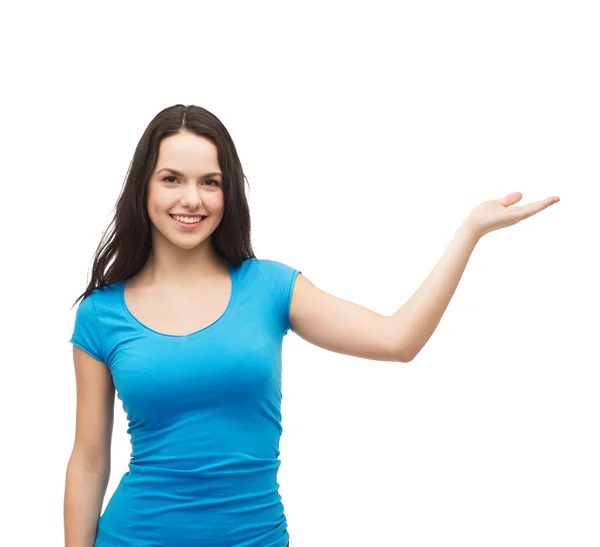 Teenager holding something on the palm of her hand — Stock Photo, Image