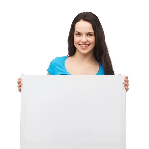 Smiling young girl with blank white board Stock Picture