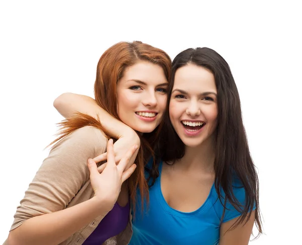 Two laughing girls hugging Stock Photo