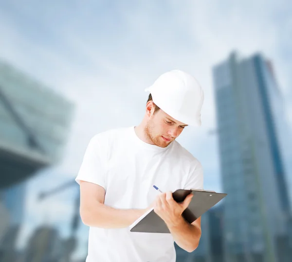 Male architect looking at blueprint — Stock Photo, Image