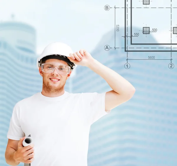 Male architect in white helmet with blueprint — Stock Photo, Image