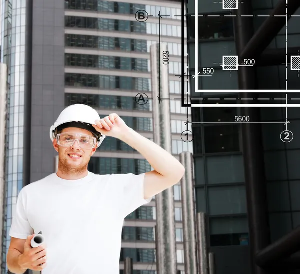 Male architect in white helmet with blueprint — Stock Photo, Image