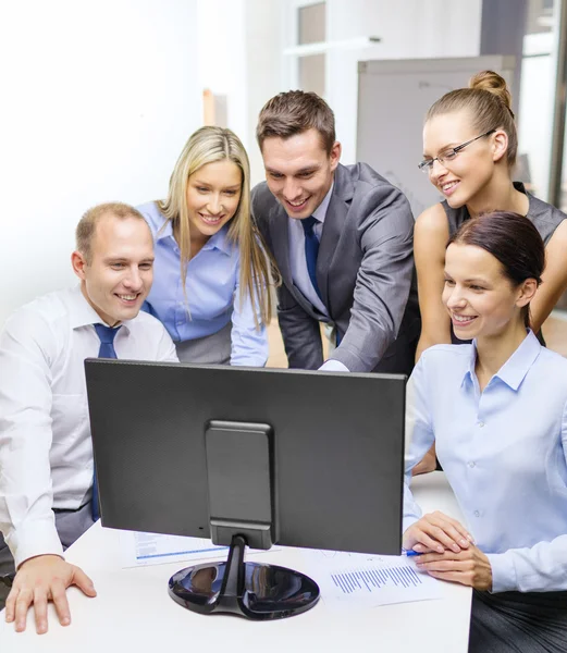 Business team with monitor having discussion — Stock Photo, Image