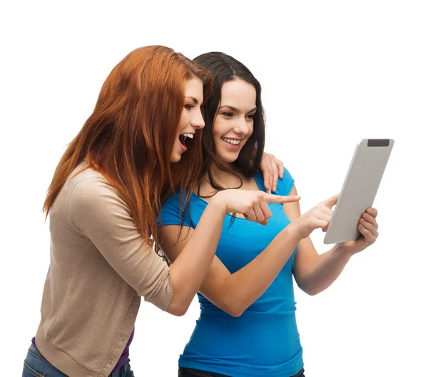 Two smiling teenagers with tablet pc computer Royalty Free Stock Photos