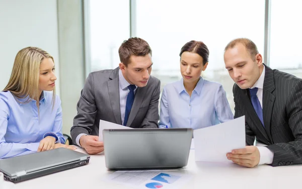 Business team with laptop having discussion Royalty Free Stock Images