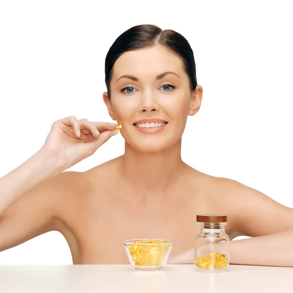 Beautiful woman with omega 3 vitamins — Stock Photo, Image