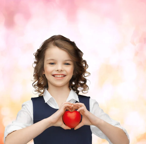 Beautiful girl with small heart — Stock Photo, Image