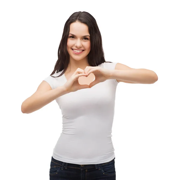 Smiling girl showing heart with hands — Stock Photo, Image