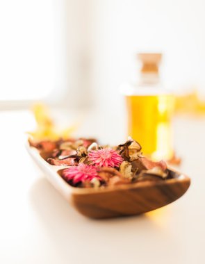 Closeup of essential oil, flowers and pot-pourri clipart