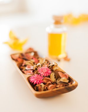Closeup of essential oil, flowers and pot-pourri clipart