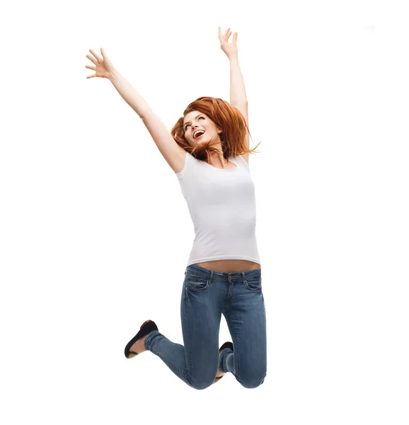 Teenage girl in white blank t-shirt jumping — Stock Photo, Image