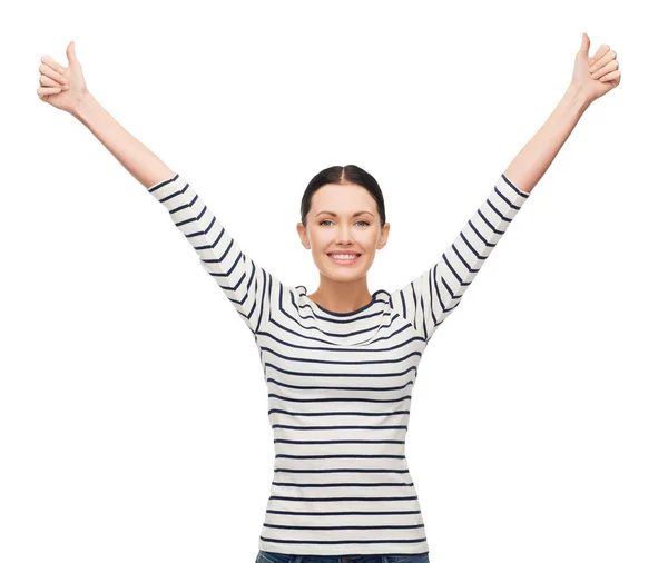 Smiling girl in casual clother showing thumbs up — Stock Photo, Image