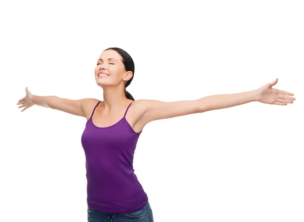 Smiling girl in blank purple tank top waving hands — Stock Photo, Image