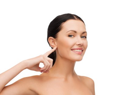 Young calm woman pointing to her ear clipart