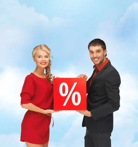 Smiling man and woman with percent sign — Stock Photo, Image