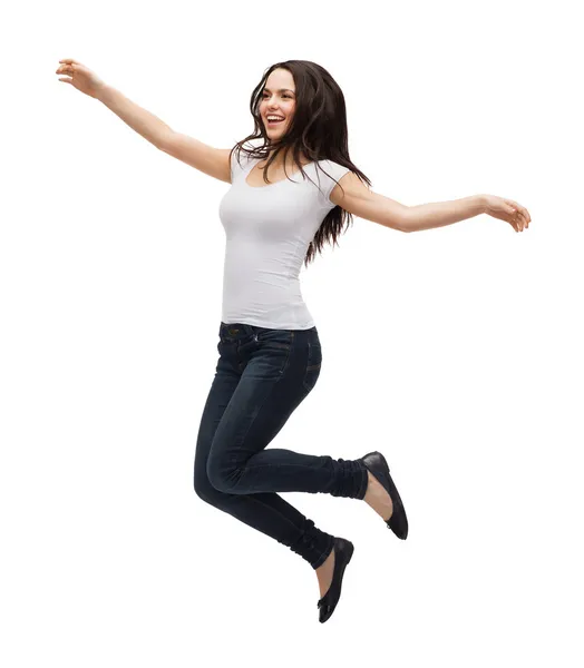 Adolescente em branco t-shirt jumping — Fotografia de Stock