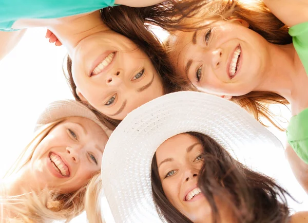 Faces of girls looking down and smiling — Stock Photo, Image