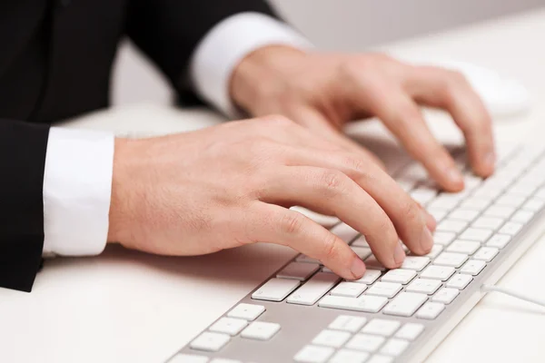 Businessman working with keyboard — Stock Photo, Image