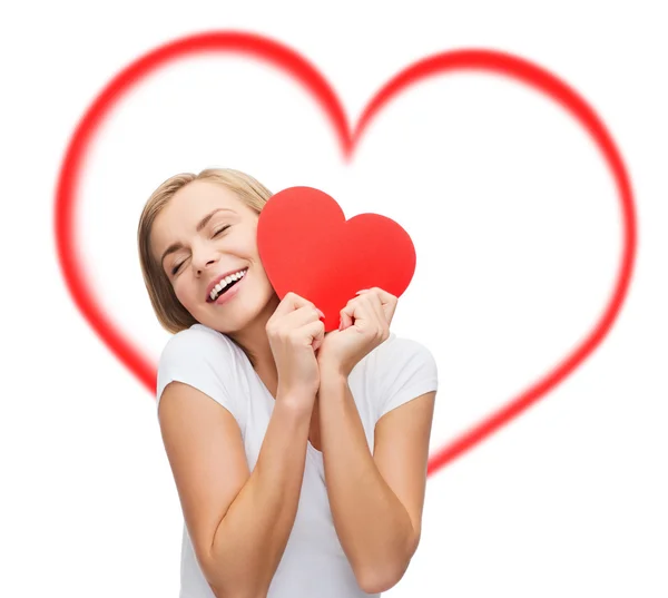 Smiling woman in white t-shirt with heart — Stock Photo, Image