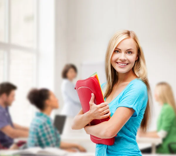 Smiling student with folders — Stock Photo, Image