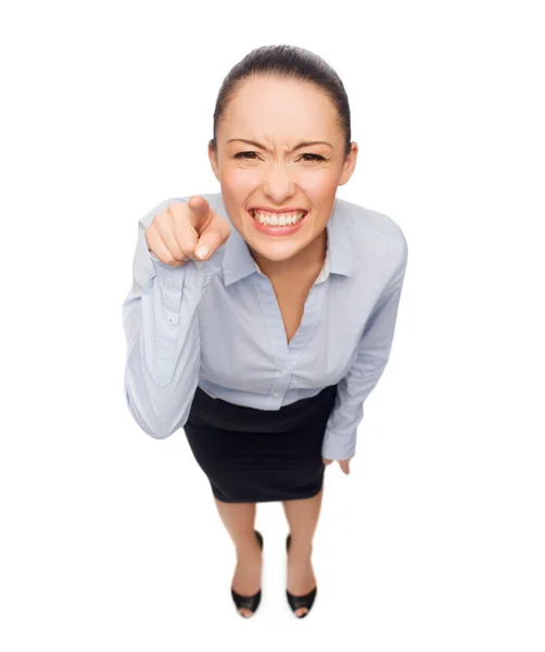 Angry businesswoman pointing finger at you — Stock Photo, Image