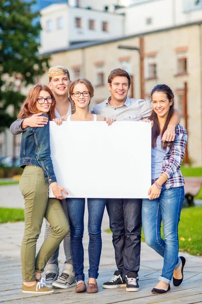 Students or teenagers with white blank board — Stock Photo, Image