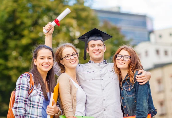 Students or teenagers with files and diploma — Stock Photo, Image