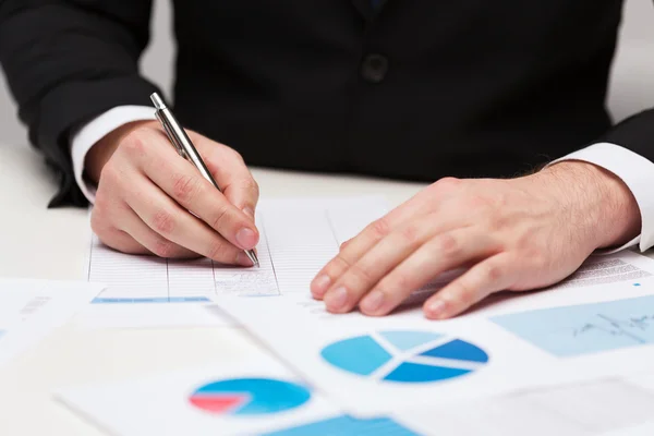 Close up of businessman with papers — Stock Photo, Image