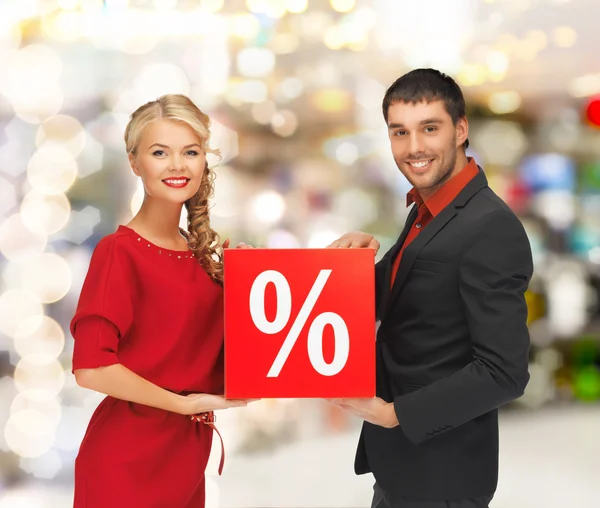 Smiling man and woman with percent sign — Stock Photo, Image