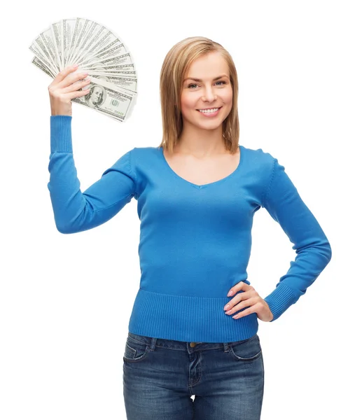Chica sonriente con dinero en efectivo en dólares —  Fotos de Stock