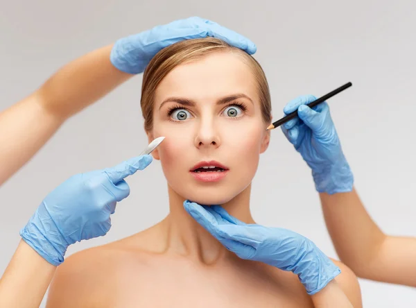 Woman face and beautician hands with pencil — Stock Photo, Image