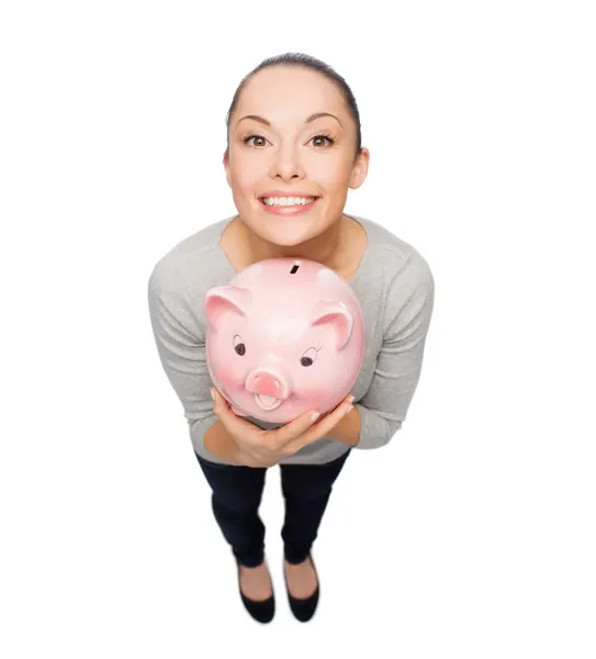 Mulher feliz com banco porquinho — Fotografia de Stock