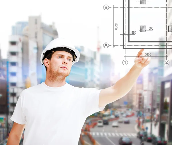 Male architect pointing to blueprint — Stock Photo, Image