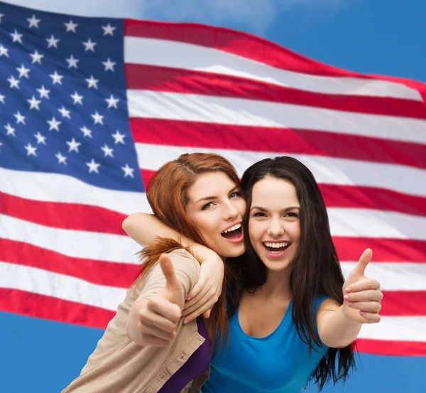 Two smiling girls showing thumbs up — Stock Photo, Image