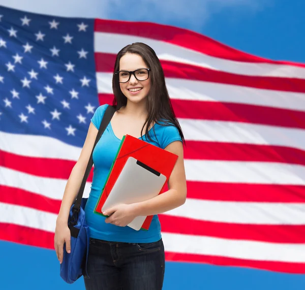 Smiling student with bag, folders and tablet pc — Stock Photo, Image