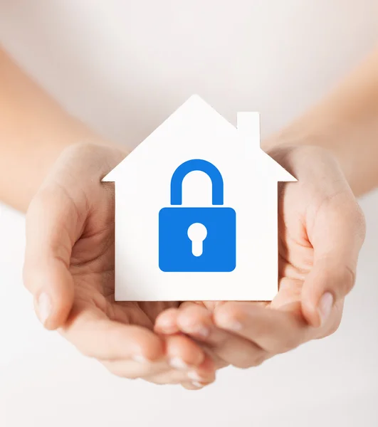 Hands holding paper house with lock — Stock Photo, Image