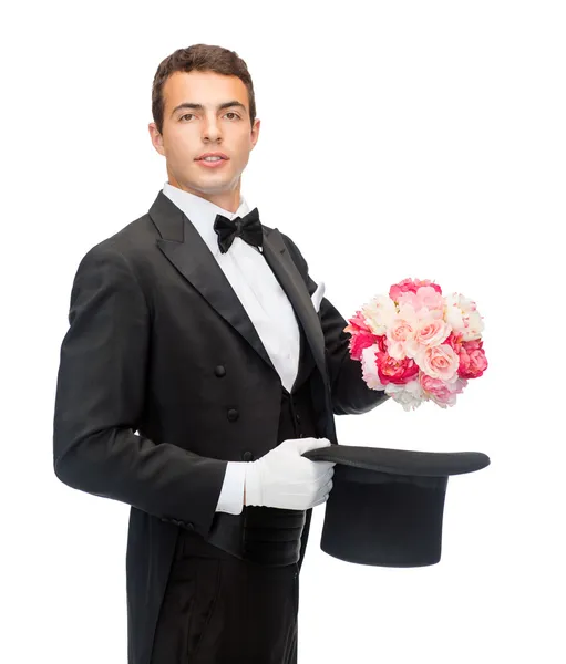 Magician with flower bouquet — Stock Photo, Image