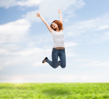 Teenage girl in white blank t-shirt jumping clipart