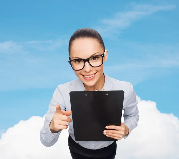 Smiling businesswoman in eyeglasses with clipboard — Stock Photo, Image