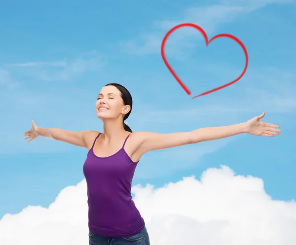 Smiling girl in blank purple tank top waving hands — Stock Photo, Image